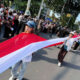 Nyalakan Nasionalisme, Merah Putih Sepanjang 100 Meter Terbentang di Karnaval Paskah Kota Semarang